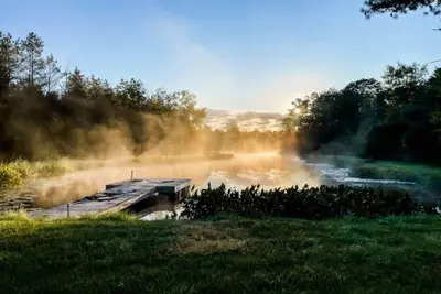 Image de Bring family and friends to this beautiful, spacious, open plan log home.