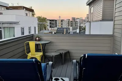 2 bedroom townhome w fire place & rooftop deck.