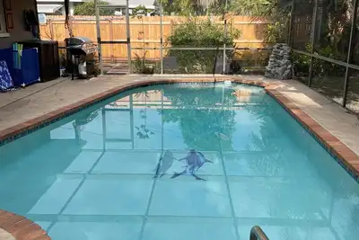 Tropical vacation house with large, heated pool and spacious, open floor plan