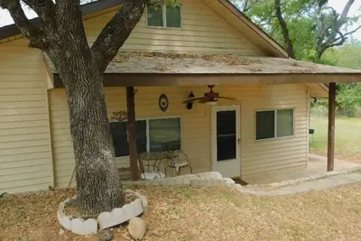 Image de house and lighted deck fenced yard\n