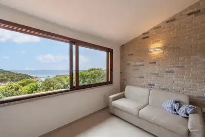 Image de Appartement \"Casa Vacanza Porto Luna Villasimius\" avec vue sur mer, A/C et Wi-Fi