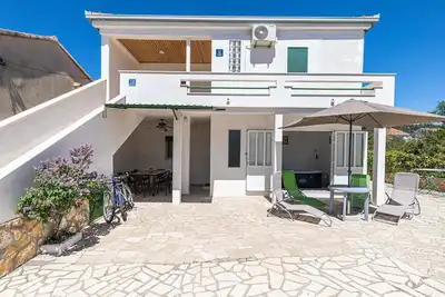 Image de Maison en bord de mer à Vinisce avec.