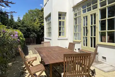 Image de Large beautiful unusual house with lots of character and art on the walls.