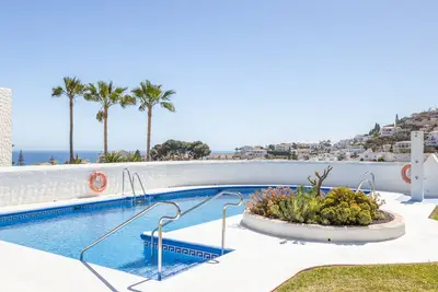 Image de Villa 'Casablanca 25' à Nerja près de la plage avec piscine partagée et Wi-Fi.