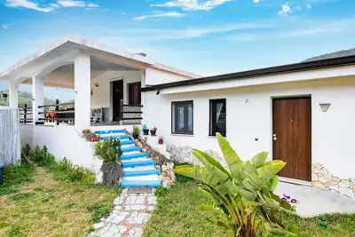 Image de Maison de vacances 'Casa I Ginepri' avec vue sur la montagne, jardin et Wi-Fi
