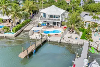 Waterfront home with dock, pool table & private pool - walk to Sombrero Beach