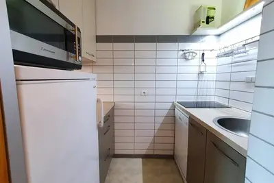 Image de À 50m des pistes de ski, Rez-de-chaussée, vue montagne, balcon, télévision, casier à ski, 27m²