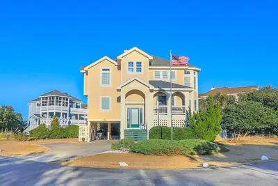 Gorgeous 5 bedroom home with community pool, direct beach access, charcoal grill, and keyless entry