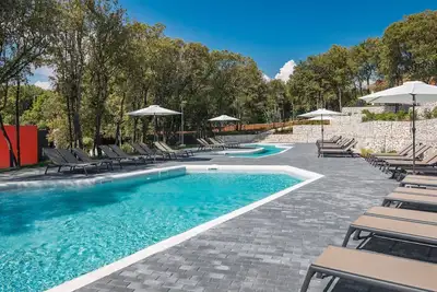 Image de Appartement avec climatisation, piscine, Wifi, bain à remous, Tv, terrasse