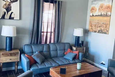 Image de Modern and Cozy Apartment with large windows and sunlight.