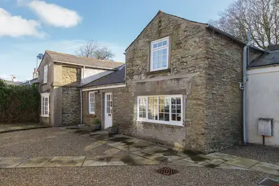 Image de Woodcroft is a charming cottage located in wonderfully leafy surroundings right in the heart of Doug