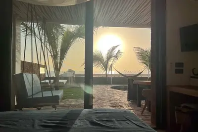 Image de Beachhouse Mima, pied dans l'eau et avec tout le comfort possible!