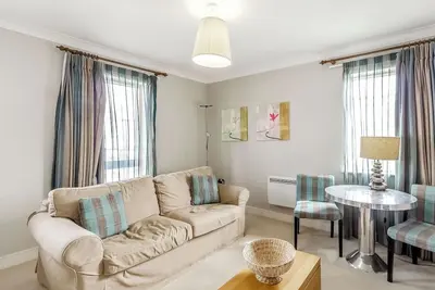 Image de A stunning apartment resting on Northern Coast with balcony with outdoor furniture.
