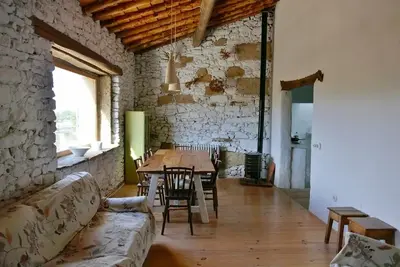 Image de Stone house with garden, barbecue and fireplace.