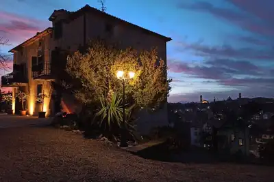Image de The terrace overlooking the village, a restored Tuscan farmhouse.