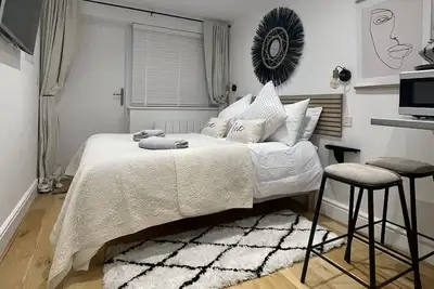 Stylish modern one bedroom with kitchenette and en suite shower room