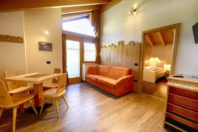 Image de Appartement Paradisin - Baita Cusini avec vue sur les montagnes, espace bien-être et Wi-Fi.