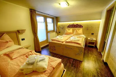 Image de Appartement Casciana - Baita Cusini avec vue sur les montagnes, espace bien-être et Wi-Fi.