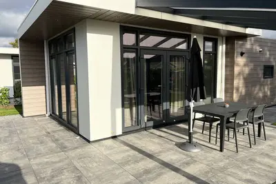 Image de New, modern vacation home in the vacation park by the lake