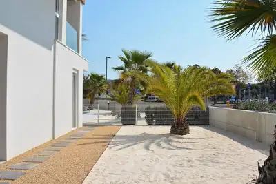 Apartment with Pool and a spacious patio with sand