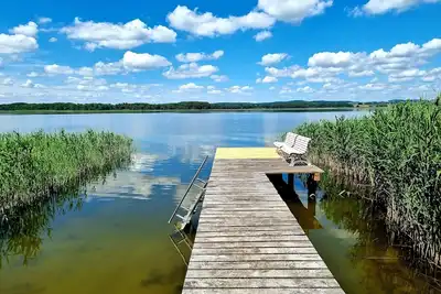 Image de Bungalow incl. boat directly on the lake