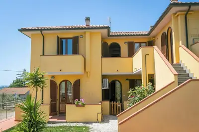 Image de Appartement 'Bilocale Olivastra' avec balcon, piscine partagée et Wi-Fi