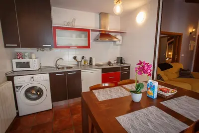 Image de La Casa de la Maestra 2 is a charming house, typical of a town, with a warm and welcoming decoration.