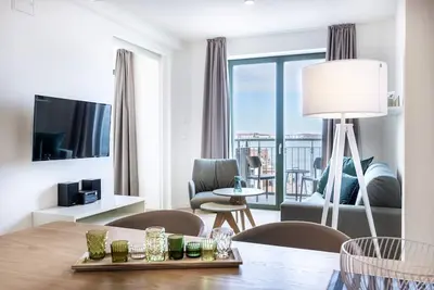 Image de First-class harbor apartment with balcony, use of sauna and great view!