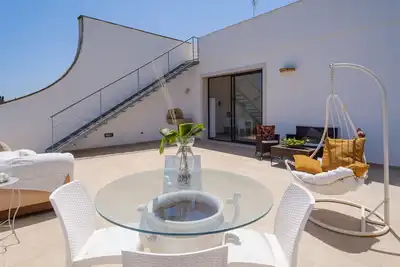 Image de Appartement de vacances 'Villa Scoglio' près de la mer avec jardin et terrasse privée