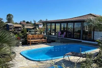 Image de Villa Santorini Praia do Rosa with pool and jacuzzi