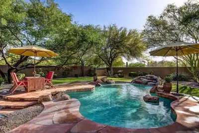 Resort like backyard w/ Heated pool. Home Theater