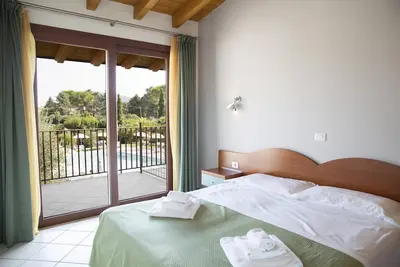 Image de Résidence Molino Trilocale 10 avec piscine, terrasse et Wi-Fi