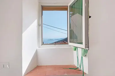 Image de Maison de vacances \"Tavernetta in Campagna\" avec vue sur mer et jardin.