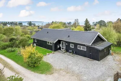 Image de Belle maison à Knebel avec sauna