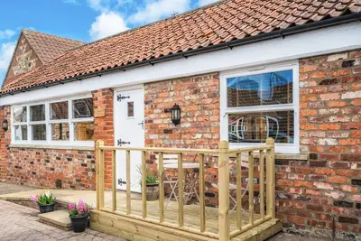 The Old Tractor Shed, pet friendly, with a garden in Skipsea