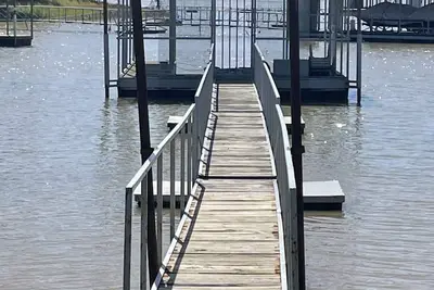 Image de Lake front retreat, covered boat dock, large deck, fenced play area, Rv parking