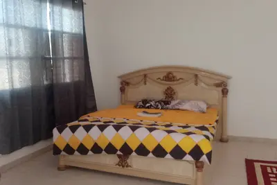 Furnished room inside a villa with attached bathrom