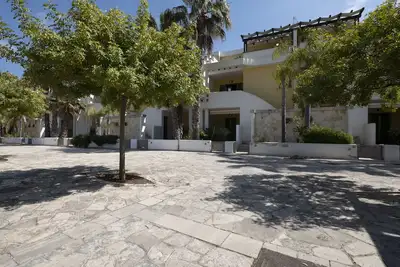 Image de Villa Mimosa located in the Ammiragia Residence in Baia Verde, 9/10 beds