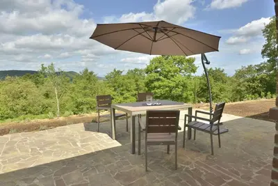 Image de Joli appartement avec climatisation, Wifi, piscine, Tv, patio, animaux admis et vue panoramique