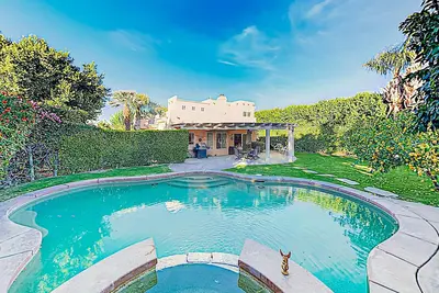 Expansive home with fireplace, heated pool & and spa in backyard haven