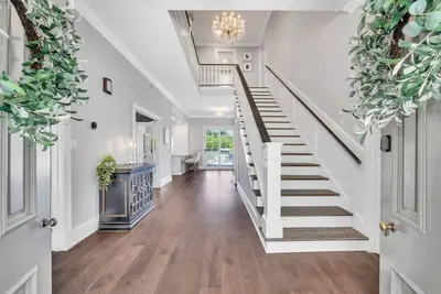 Luxury lakefront living w/ dock, pub, game rm