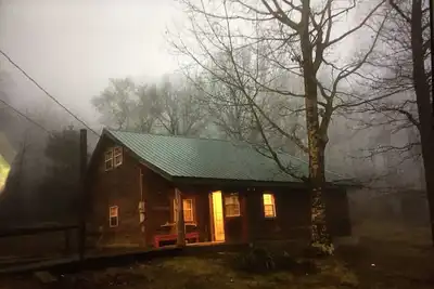 Rustic log cabin in the woods with great sunset views