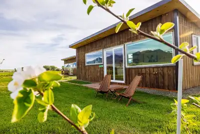 Image de Off-grid tiny home in apple orchard with million-dollar mountain views!