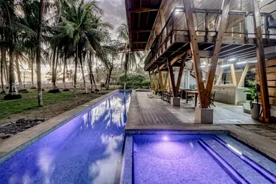 Image de Open, dog-friendly, beachfront house with a private pool, pool spa, & WiFi