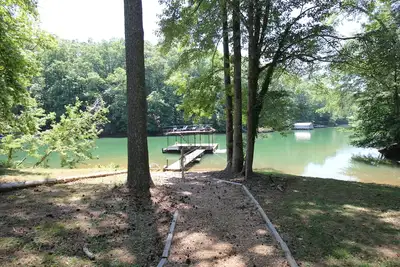 Quiet lake cove home with single slip dock