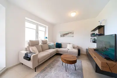 Image de Cozy maisonette vacation apartment close to the beach in a dyke location with balcony overlooking the sea