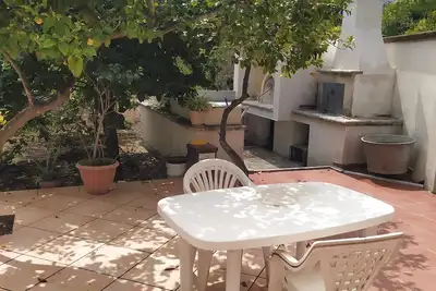 Country house with terrace in the shade of lemon trees