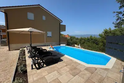 Image de Maison de vacances Vrbnik pour 1 - 4 personnes avec 2 chambres Ă coucher - Maison de vacances