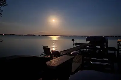 Image de Green Lake home with a shallow sandy beach on the north shore.
