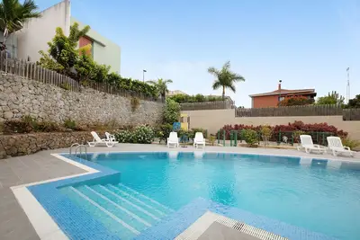 Maison de vacances 'La Quinta Adosado' avec vue sur mer, piscine partagée et Wi-Fi.